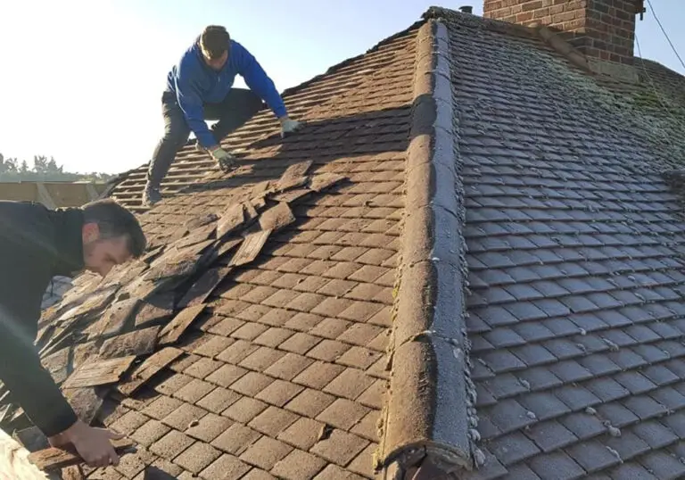 roofers working on a roof in the middle of the day